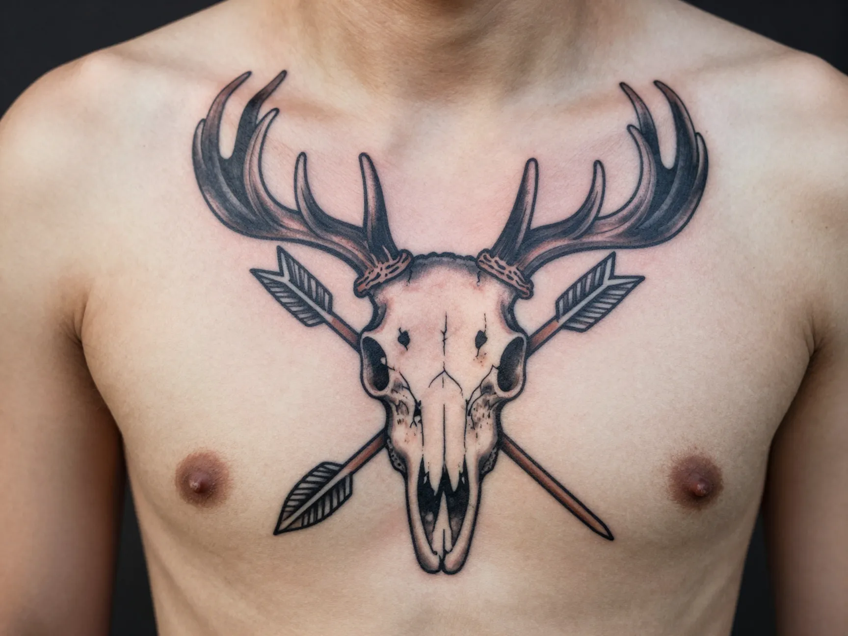 Crossed arrows with deer skull